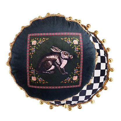 Dark green velvet round cushion cover with embroidered rabbit floral motifs and gold tassels for living room decor