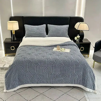 Gray quilted bedroom quilt with white fleece trim featuring a layered flannel arch plush blanket design