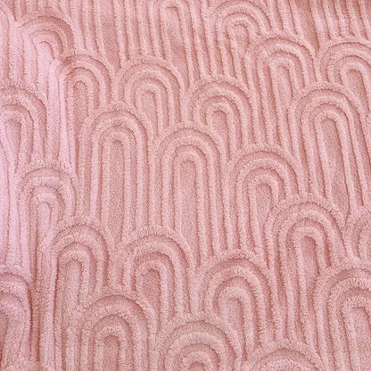 Soft pink double layered flannel plush blanket with textured wave pattern for bedroom quilt use