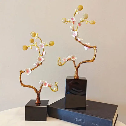 Pink and white golden tree crystal ball statue with delicate flowers and glossy yellow beads on a black base decorbites golden tree decor