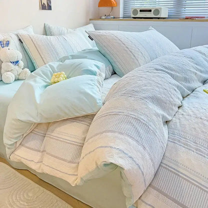 Soft pastel blue and white striped quilted duvet set with cozy textured fabric finish in decorbites jacquard cotton bedding set