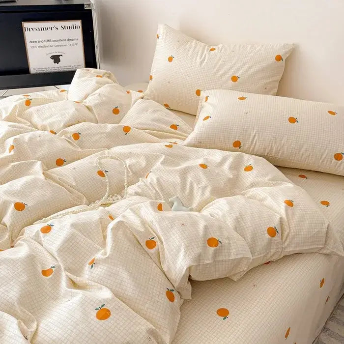 Cream-colored cotton grid bedding set with subtle plaid pattern and orange fruit prints for bedroom decorbites cotton grid