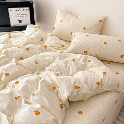 Cream-colored cotton grid bedding set with subtle plaid pattern and orange fruit prints for bedroom decorbites cotton grid