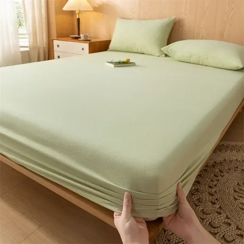 Light green smooth finish cotton fitted sheet with elastic edge from decorbites soft textured weave collection