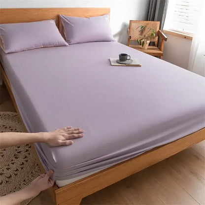 Lavender-colored cotton fitted sheet with smooth stretchy fabric finish complementing plaid green and beige decorbites cotton fitted sheet