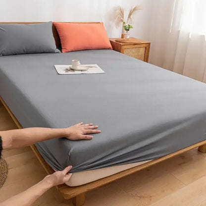 Gray stretch fitted sheet with smooth design paired with plaid green beige decorbites cotton fitted sheet texture