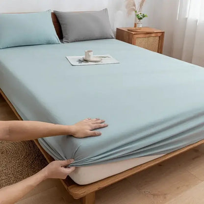 Light blue stretchy cotton fitted sheet with smooth finish complements plaid green and beige decorbites cotton fitted sheets