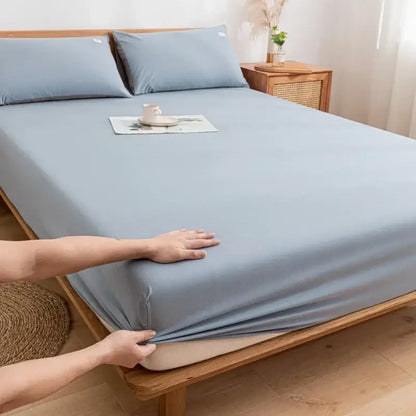 Light blue smooth textured cotton fitted sheet with matching pillowcases for soft decorbites bedroom use