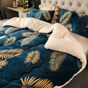 Deep blue quilted super thick warm blanket with golden palm leaf patterns and plush white milk fleece interior