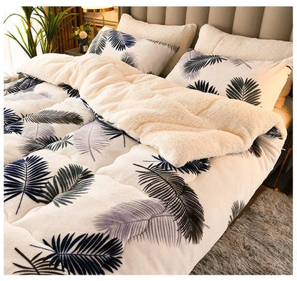Cream-colored plush duvet set with soft fluffy milk fleece and bold black gray palm leaf patterns for winter warmth