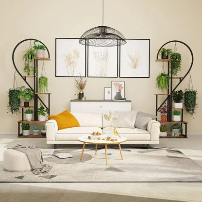 White sofa with mustard yellow pillow and gray cushions beside a DecorBites™ 6-tier heart shaped plant display stand