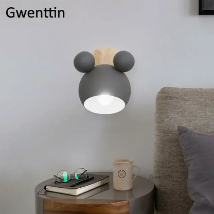 Gray cartoon mouse wall lamp with wooden ears and matte finish by decorbites for playful kids bedroom decor