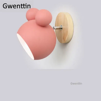 Pastel pink matte wall lamp with whimsical bear design and light wood backplate for kids bedroom decorbites cartoon mouse