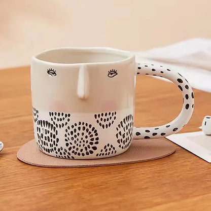 Cream-colored 340ml ceramic coffee milk mug with black dot patterns, embroidered eyes, and a polka-dotted handle