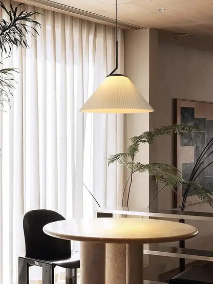 A modern pendant light with a cream pleated fabric shade and black metal frame ideal for dining room decorbites cream led