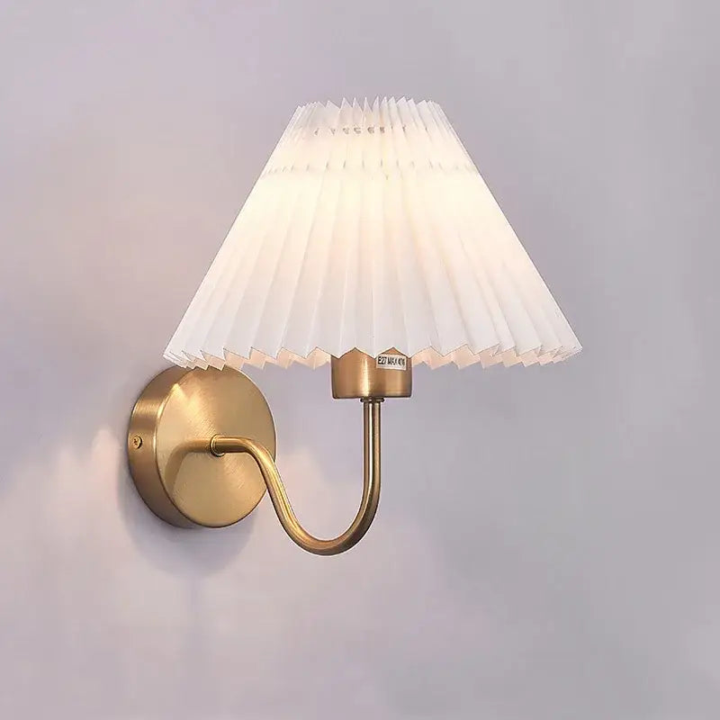 Pleated white cloth lampshade led wall lamp with brass finish and elegant curved arm for bedroom decorbites cloth lampshade