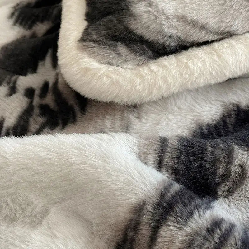 Plush black and white leopard bed set featuring a cozy rabbit hair throw blanket with soft white and gray stripes decorbites cozy rabbit