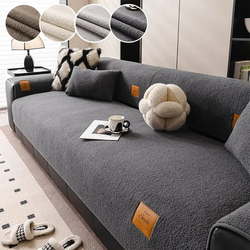 Gray plush sofa cover with soft textured surface and tan leather-like brand tags for living room use