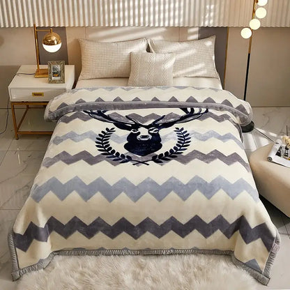 Cream-colored plush double layer raschel blanket with gray chevron pattern and black deer head emblem framed by laurel leaves