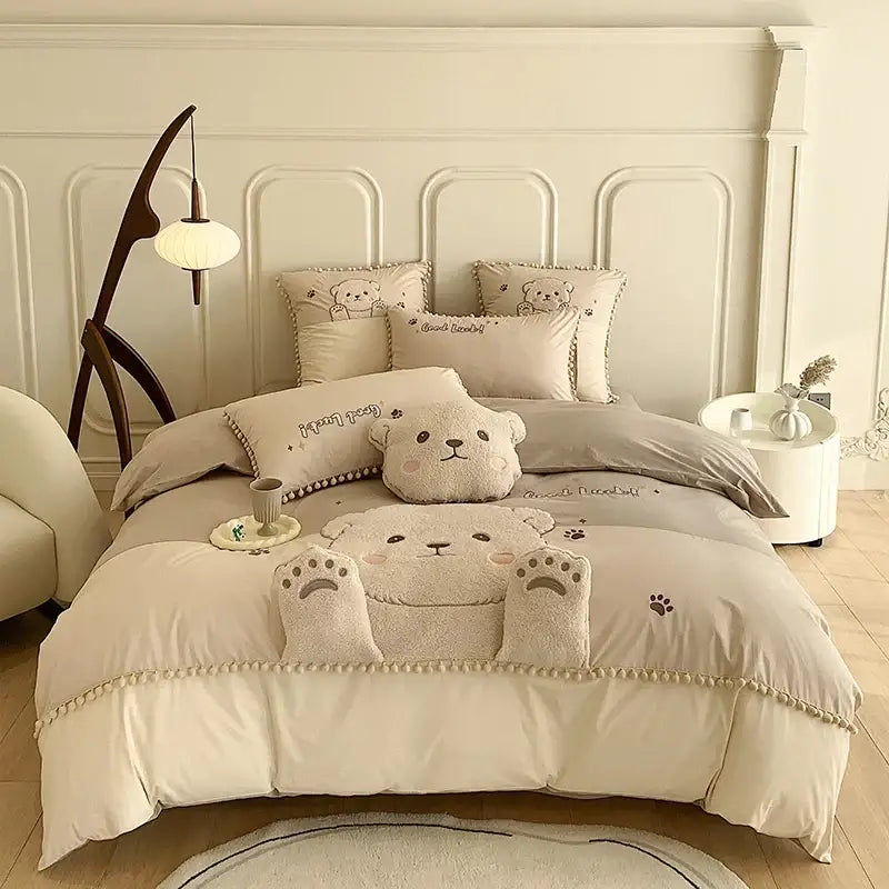 Cream-colored cotton bedding set with plush cartoon bear applique and soft textured fabric quilt cover