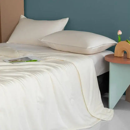 Plush cream cooling comforter made of silky soft satin sheet with smooth glossy finish for decorbites cooling comforter