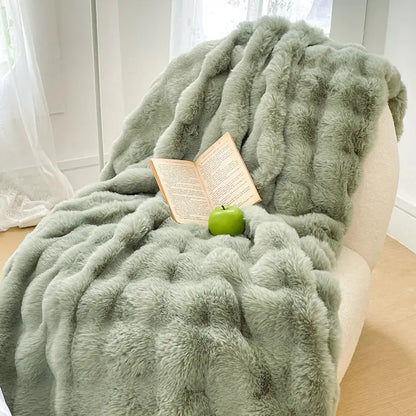 A plush cream and gradient pink double layer faux fur bedroom blanket with mint green soft textured surface and ruching details