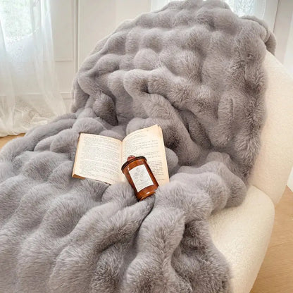 A plush gray faux fur throw blanket with a soft textured surface complements decorbites gradient pink double layer design