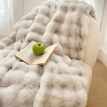 A plush cream and gradient pink double layer faux fur bedroom blanket with light gray textured tufted design decorbites gradient pink