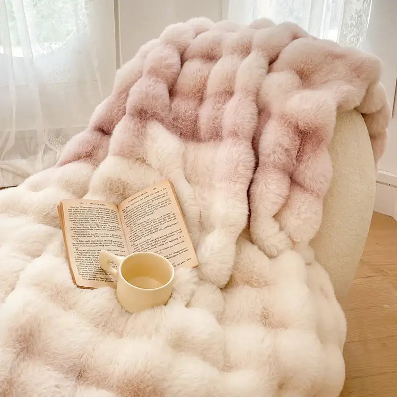 A plush cream and gradient pink double layer faux fur throw blanket with chunky knit texture for cozy decorbites style
