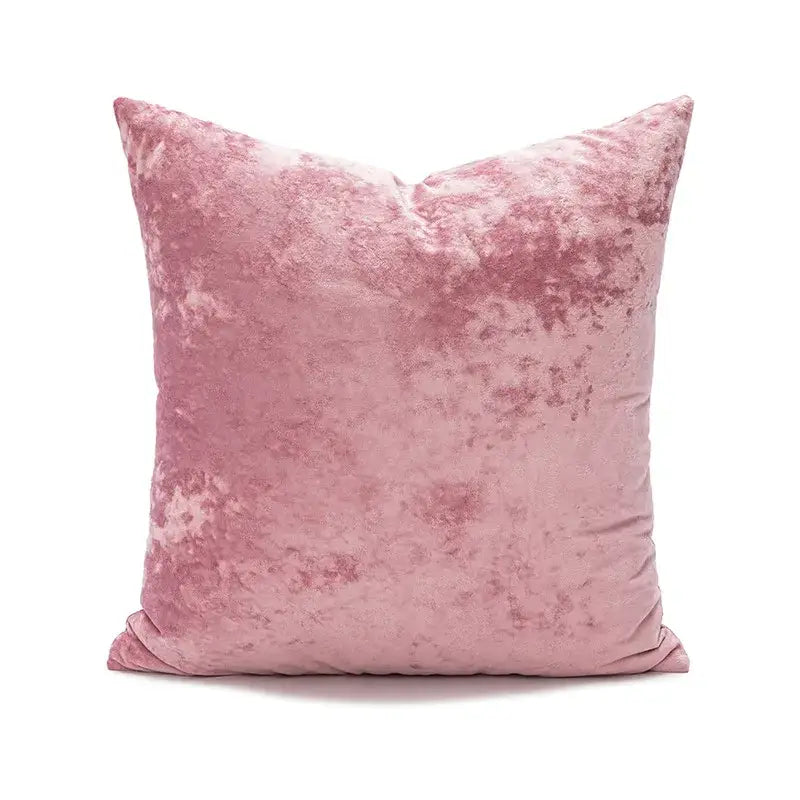 A plush dusty rose velvet pillow cover with dark grain texture ideal for living room decor
