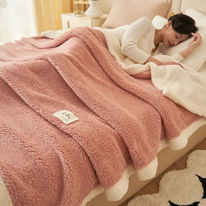 Soft pink and cream plush coral fleece blanket with fluffy texture and pom-pom trim decorbites coral fleece decorbites coral