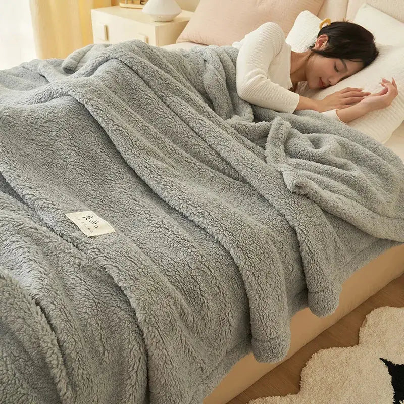 Plush gray and cream coral fleece blanket with soft textured surface for cozy sofa or bedroom decorbites coral fleece