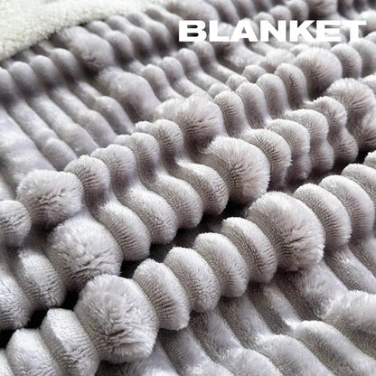 A soft light gray plush blanket with raised corduroy ridges made from cozy lamb wool by decorbites cozy lamb