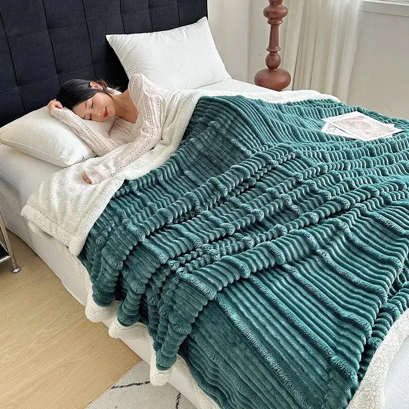 Teal ribbed plush blanket with white sherpa lining made of cozy lamb wool for bedroom decorbites cozy lamb use