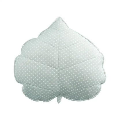 A soft light green leaf shaped throw pillow with white polka dots and stitched edges from decorbites 3d leaf collection