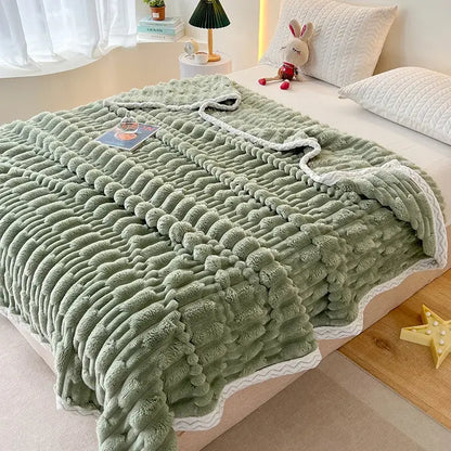 A soft moss green bamboo velvet blanket with a textured wavy pattern and white scalloped edges for bedroom use