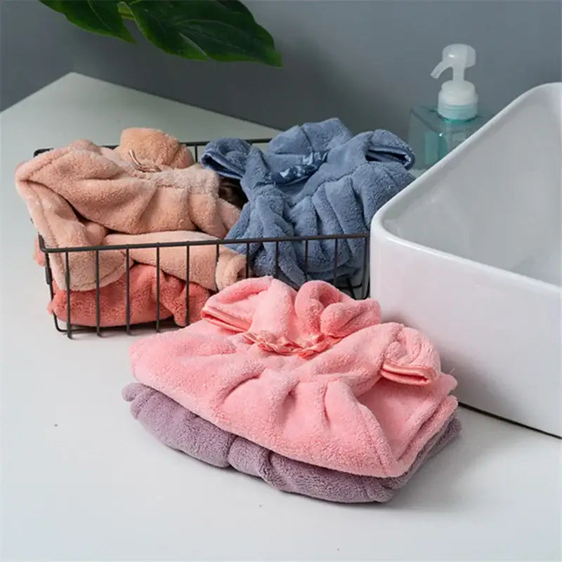Plush pink coral fleece cheongsam hand towel with gathered elastic band made of soft pink and purple microfiber for bathroom use