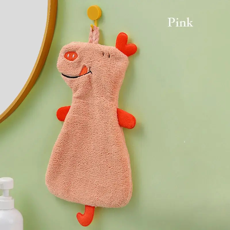 Pink plush pig-shaped hand towel with orange accents made of double-layer coral velvet for kitchen use