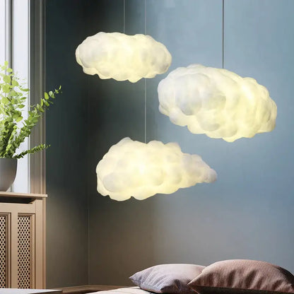 Three soft glowing white cloud led chandelier lights hanging from ceiling for nursery kids room decorbites cloud led