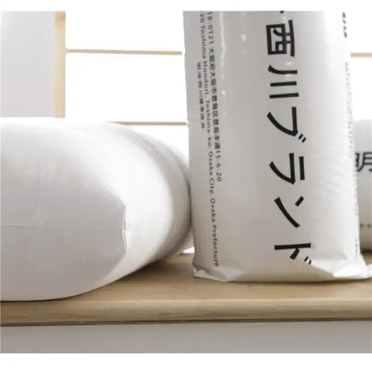 Plush white quilted cotton rectangle neck pillow with minimalist black japanese text for decorbites cotton rectangle use