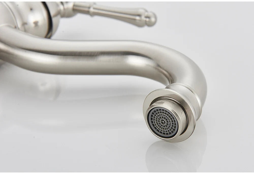 Stainless steel deck mounted single hole kitchen faucet with curved spout and decorative handle housing material metal