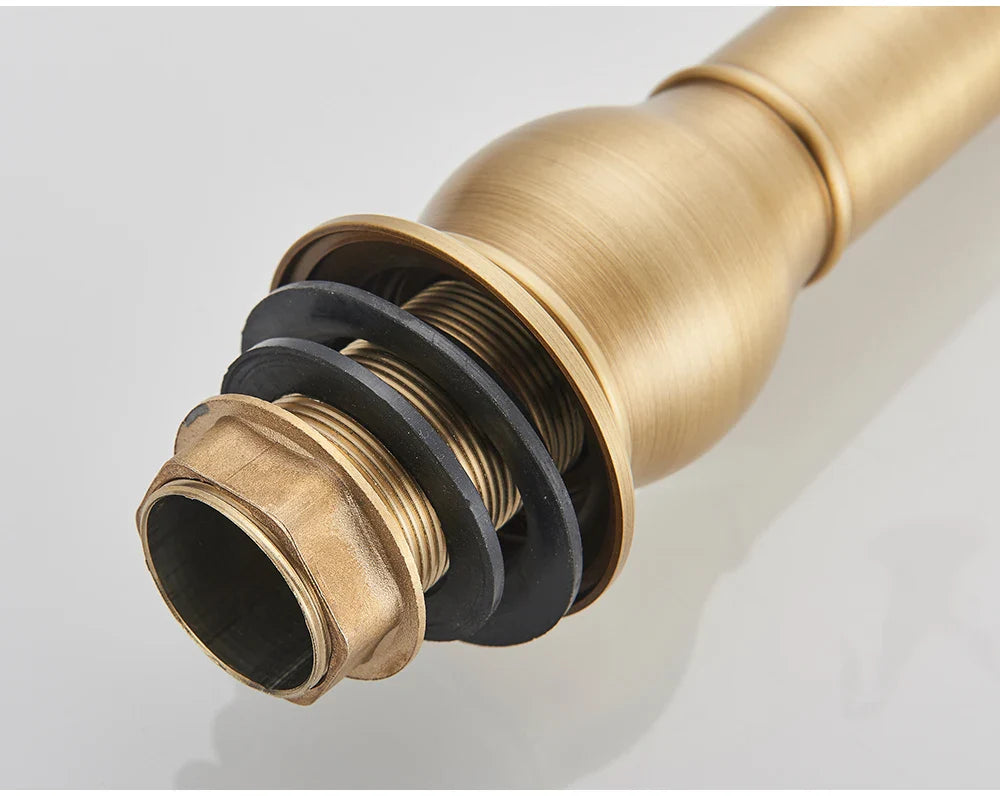 Antique brass single hole deck mounted POIQIHY bathroom faucet spout with threaded connection and black rubber seals housing material
