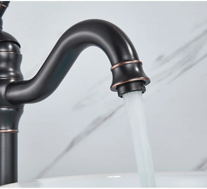 Poiqihy antique brass single hole deck mounted bathroom faucet with bronze finish, curved spout, and copper-toned accents