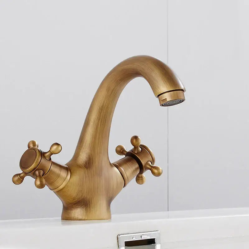Antique brass finished bathroom bidet faucet with polished brass dual cross handle and curved spout design