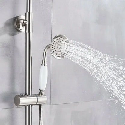 Polished chrome shower faucet set featuring a stainless steel shower head with white ceramic handle and adjustable spray pattern
