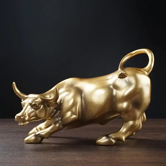 Polished gold wall street bull statue with reflective surface and detailed musculature for decorbites gold wall decor