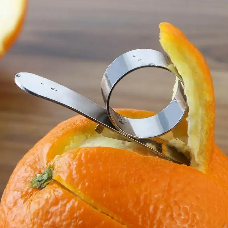 Polished stainless steel citrus peeler with sleek curved design and flat handle by decorbites citrus peeler