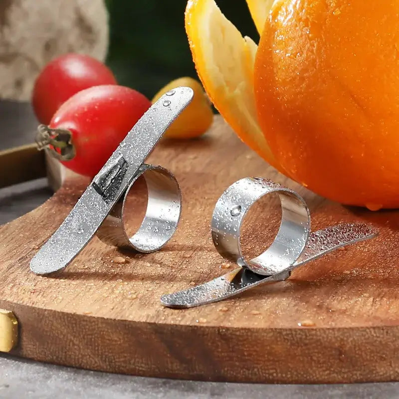 Polished stainless steel decorbites citrus peeler with sleek curved blade and ring design for easy zesting