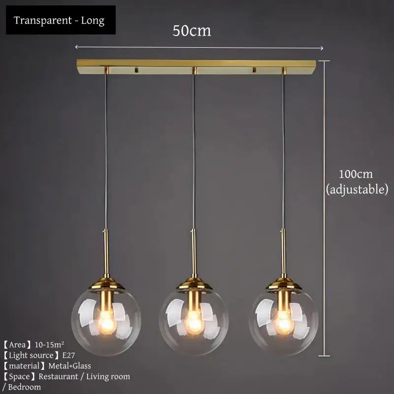 Polished steel glass pendant light trio with gold-toned metal and clear spherical bulbs for dining room lighting