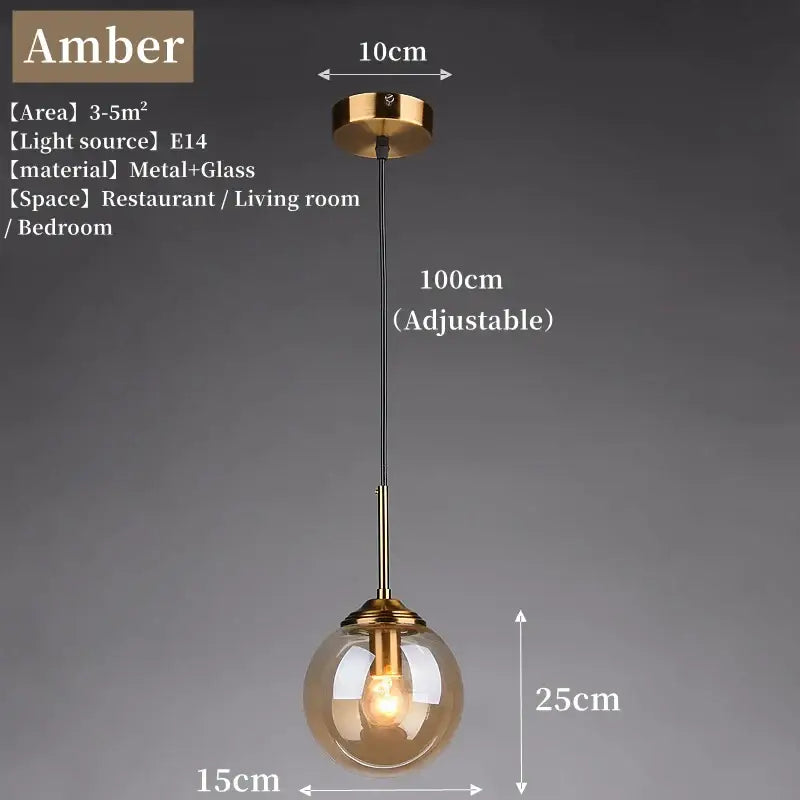 Gold-toned glass pendant light with spherical amber globe and polished steel hardware for dining room lighting